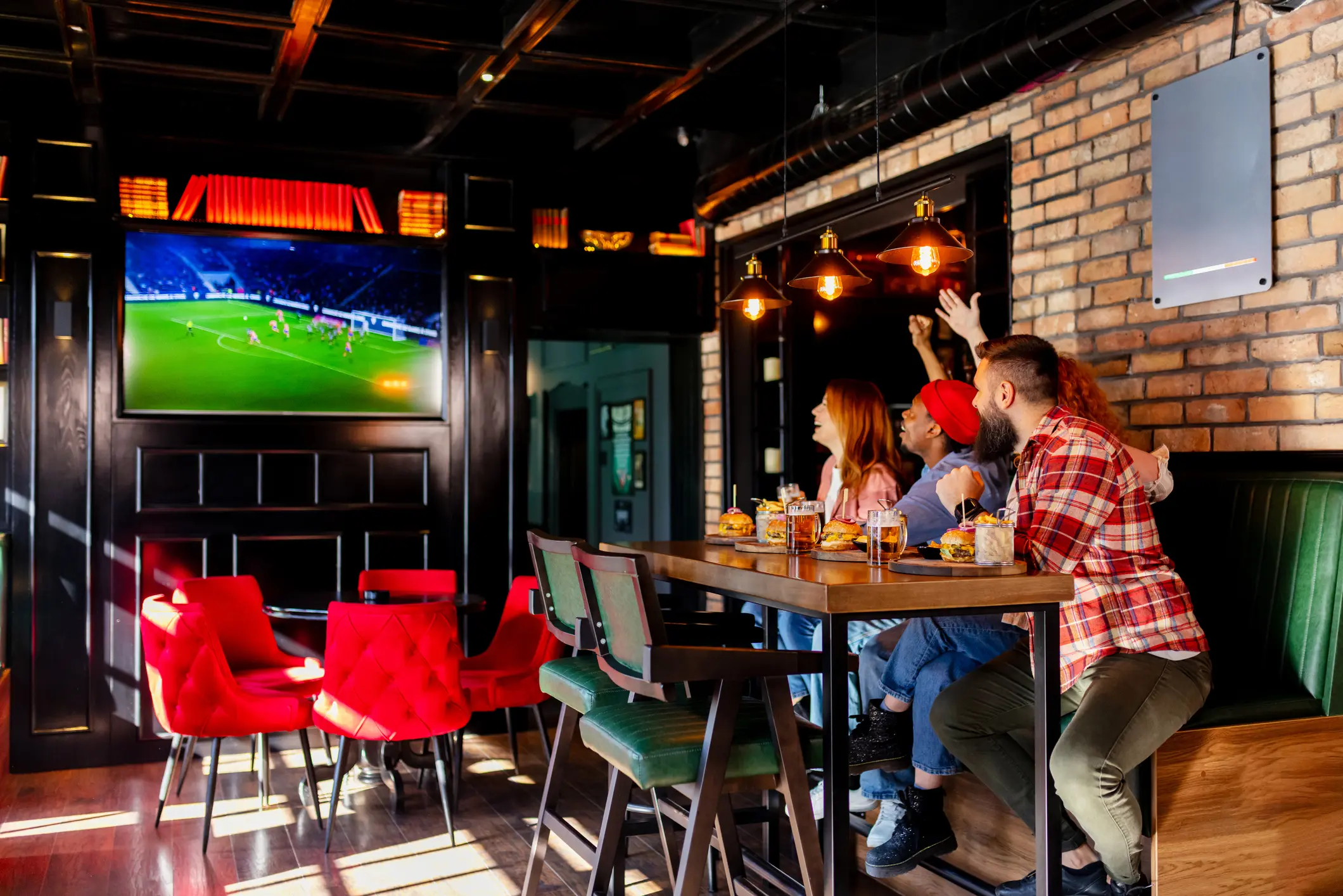 People watching football in a bar
